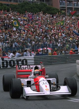 Senna raises his fist to salute the crowd after he won the Monaco Formula One Grand Prix on his McLaren-Honda Sunday, May 31, 1992.jpg