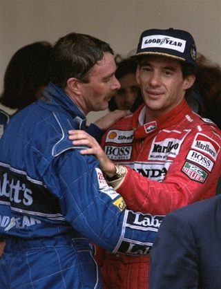 Mansell hugged by Senna May 31 1992 at the podium in Monaco after Senna won the GP Senna, in his first victory of the season, broke Mansell\'s winning streak of five victories.jpg