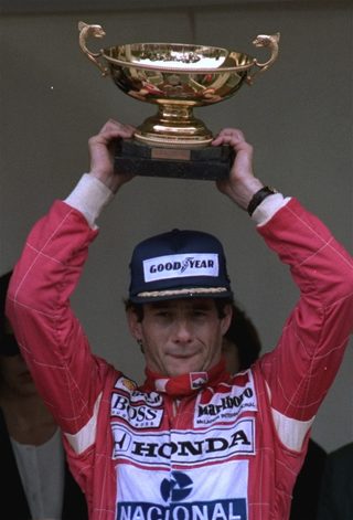 Senna raises his trophy on the podium after winning the Monaco Grand Prix May 31, 1992.jpg