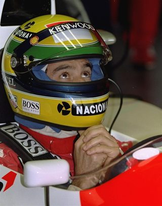 Senna sits in the cockpit of his McLaren Ford at the Silverstone July 9, 1993. Senna was waiting for the rain to clear during the morning session of practice for the British GP.jpg