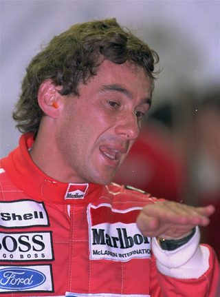 Senna describes his car\'s performance to mechanics after the morning practice session at the Spa-Francorchamps circuit Saturday, August 28, 1993 in preparation for Sunday\'s Belgian GP.jpg