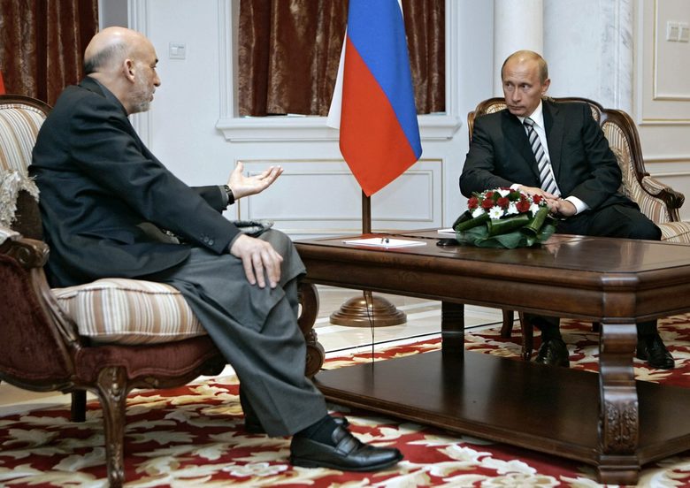 Владимир Путин и президентът на Афганистан Хамид Карзай