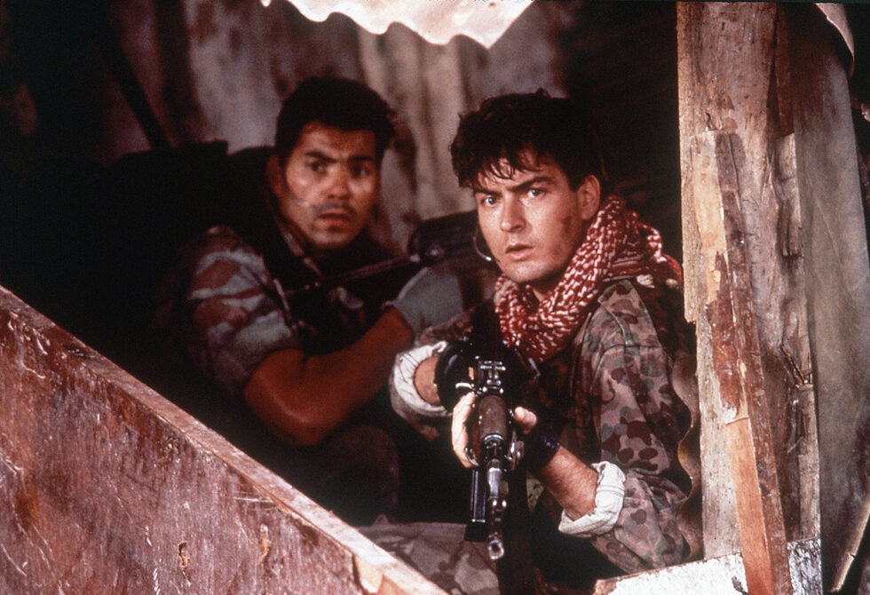 Това е кадър от "Морски тюлени" ("Navy Seals"), в който играе през 1990 г. Година по-късно се превъплъщава в образа на Топър Харли от култовата за 90-те години комедия "Смотаняци" ("Hot Shots!". Втората част на филма излиза през 1993 г. и също има касов успех. Същата година изиграва Арамис в зрелищната версия на "Тримата мускетари", където си партнира с Кийфър Съдърланд, Оливър Плат и Крис О`Донъл.<br /><br />