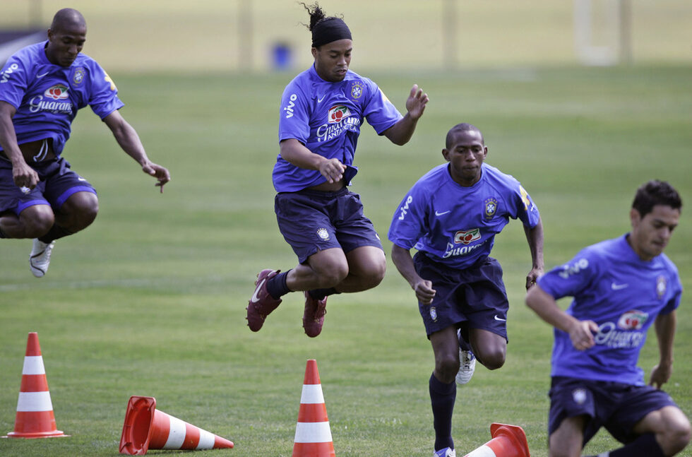 Brazil's soccer players Ronaldinho, center, who plays for Spain's Barcelona, trains with teammates in preparation for the World Cup 2010 qualifying game against Colombia next Oct. 14, 2007, at the Granja Comary in Teresopolis, Rio de Janeiro, Wednesday, Oct. 10, 2007.